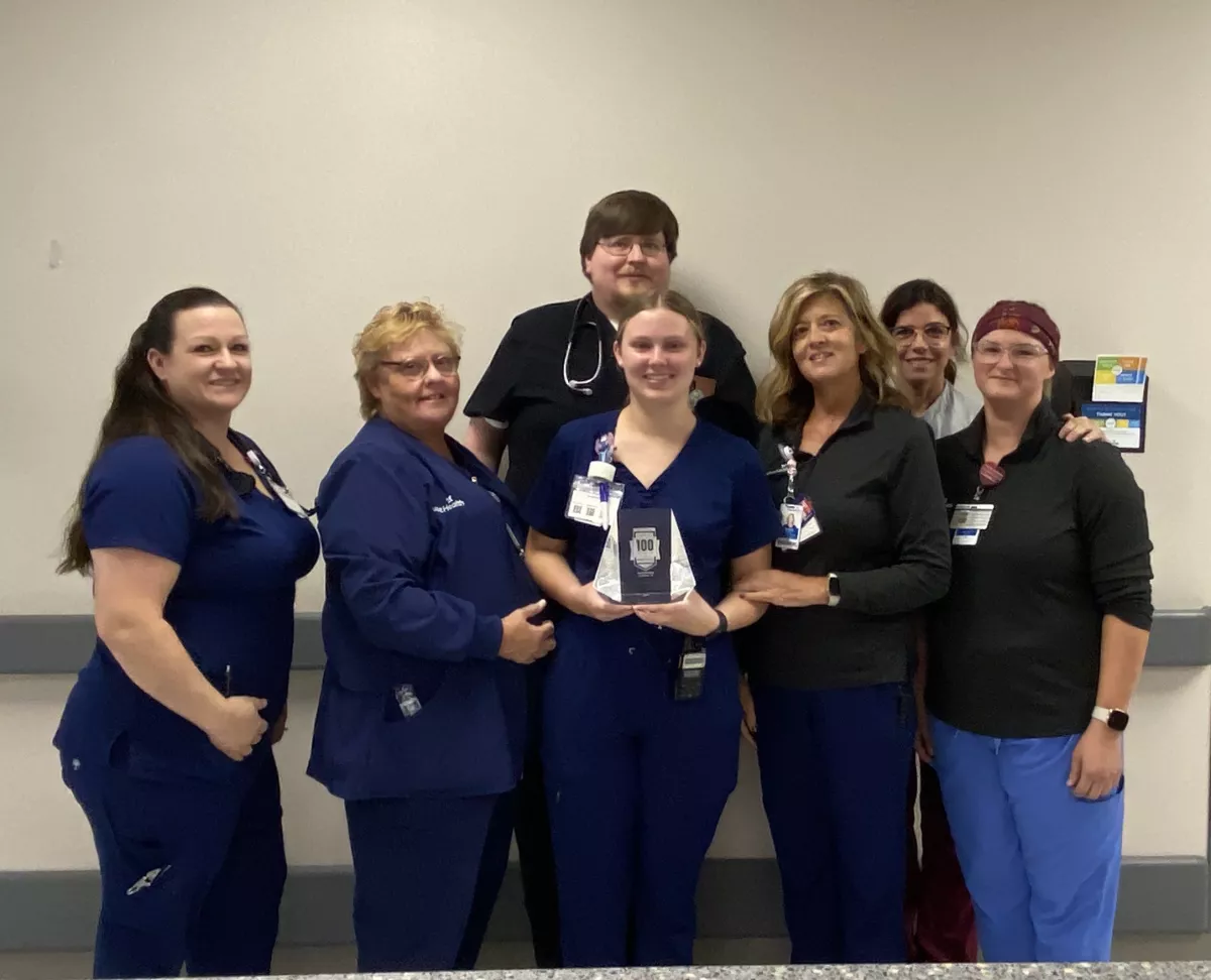 The emergency department team gathers to celebrate the 100 Top Hospital award. Left to right: April Springfield, RN, Pati Kelley, RN, Dax McKay, MD, Savannah Nix, RN, Tammy Bagley, RN, Yolanda Moyer, RN, and Rebecca Cline, PCT.