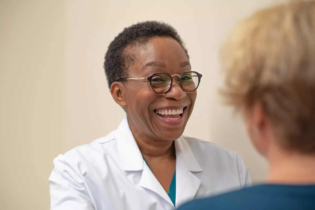Joy Nwadike, MD with a patient