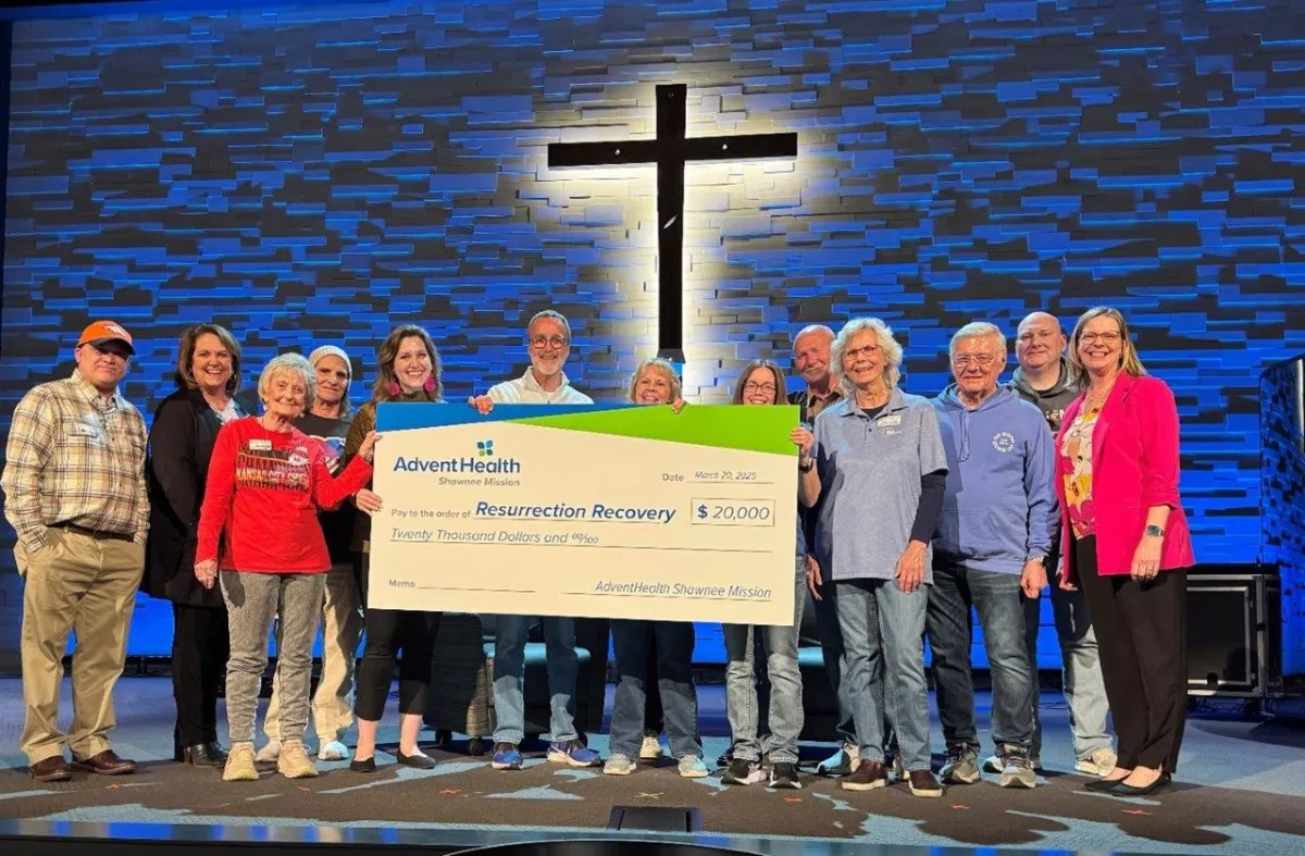 A $20,000 check is presented to a recovery program