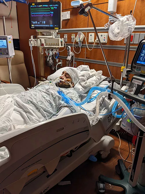 a man in a hospital bed