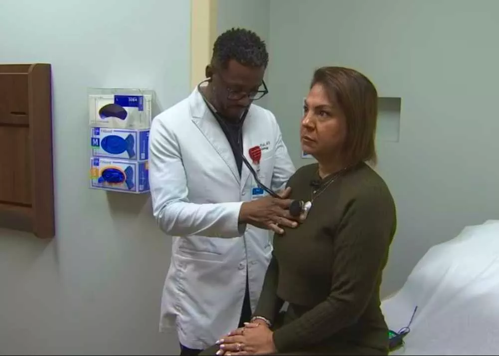 Dr. Linus Wodi seeing patient Reena Caprario at AH Apopka.