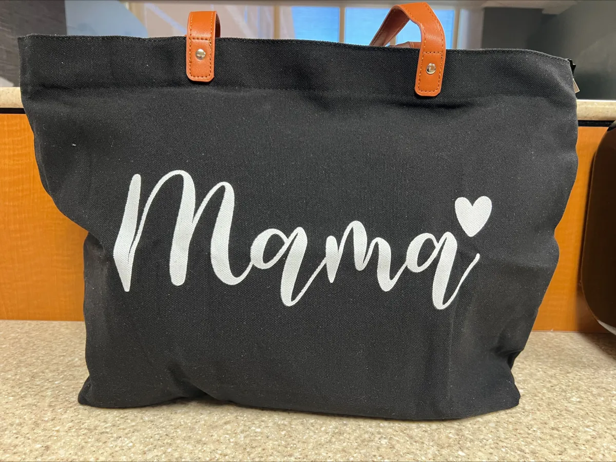 A canvas tote with the word mama written on it