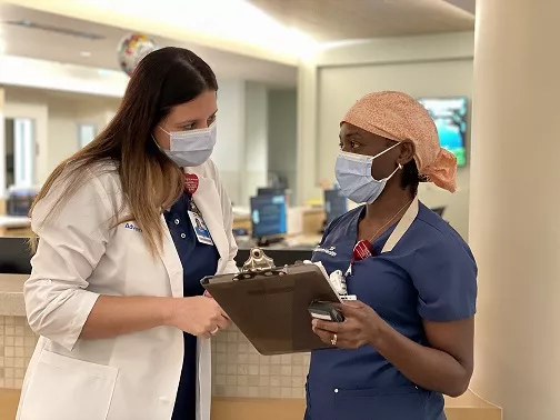Shezel O’Neal  and AdventHealth Celebration team member