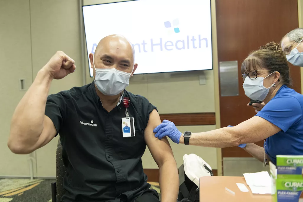 AdventHealth Orlando team member receives a COVID-19 vaccine.