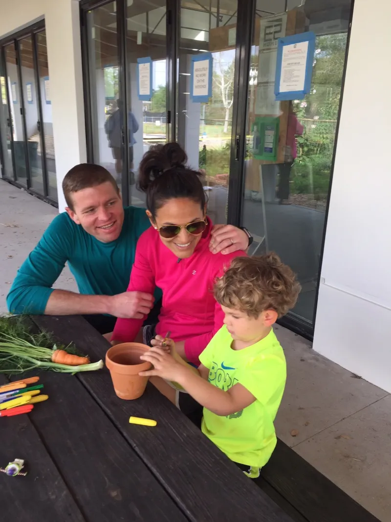 A family sitting outside at a table.