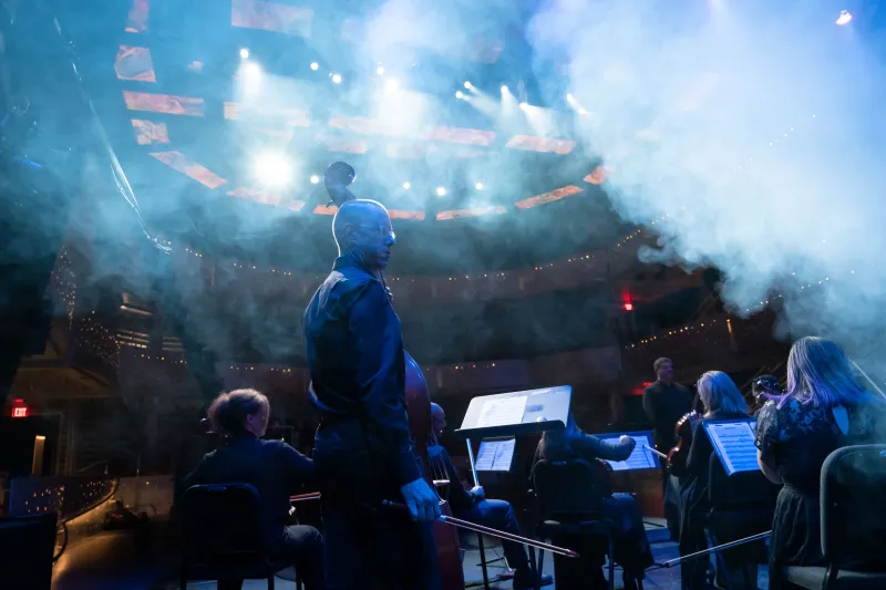 Rob Roy plays bass with the AdventHealth employee orchestra during a requiem performance.