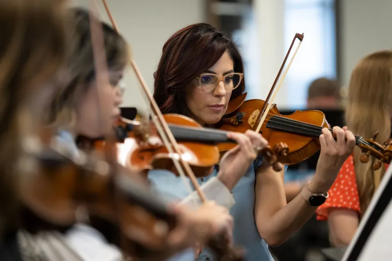 The AdventHealth employee orchestra rehearses.