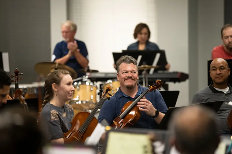 The AdventHealth employee orchestra rehearses.