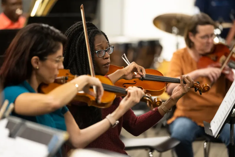 The AdventHealth employee orchestra rehearses.