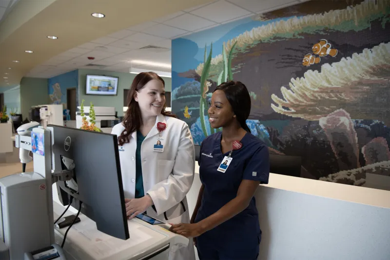 AdventHealth Employees at the FLAMINGO CROSSINGS Town Center front desk