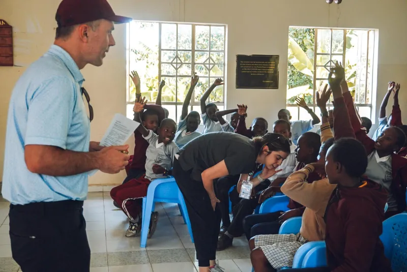 children-in-classroom-hands-raised