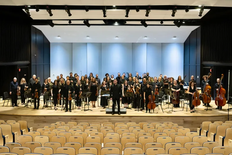 AdventHealth Orchestra on an indoor stage.