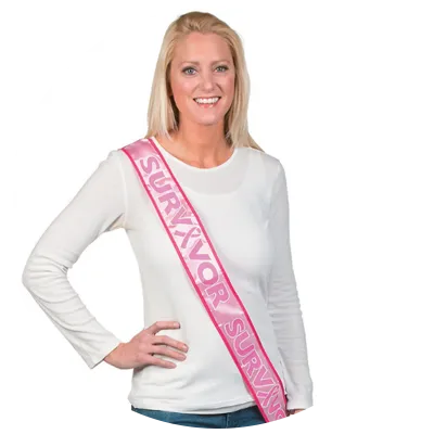 Woman wearing breast cancer survivor sash