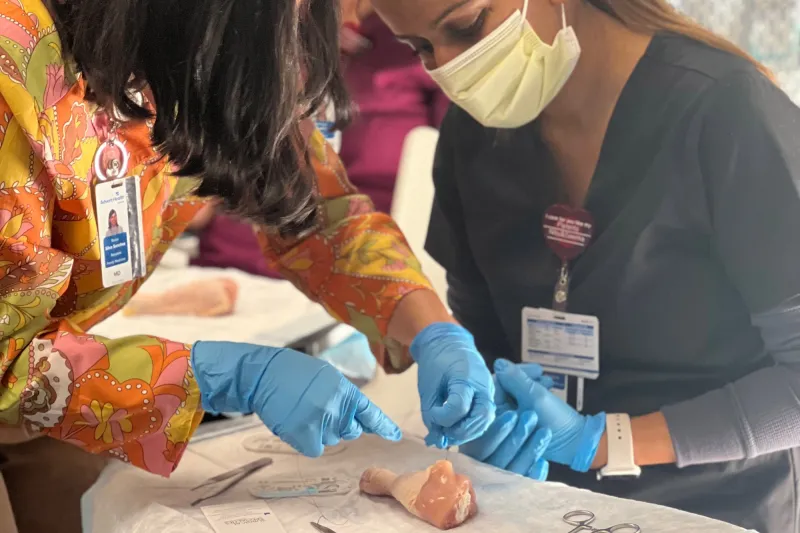 Family Medicine Residency team members doing surgery exercise